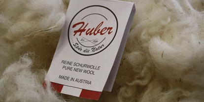 Händler - überwiegend selbstgemachte Produkte - Bleiberg - Huber Strick/Walkwaren    Wollwarenerzeugung