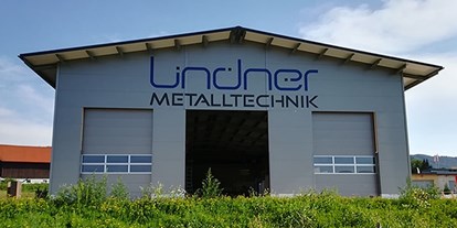 Händler - Mindestbestellwert für Lieferung - Salzburg-Stadt Freilassing - Lindner Metalltechnik: Fassadenbeschriftung - Agentur West - Manfred Salfinger