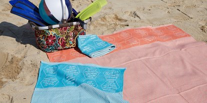 Händler - Zahlungsmöglichkeiten: Überweisung - Simbach (Fraham) - Strandtücher bzw. Freizeittuch aus BIO-Baumwolle, mit eingewebten Botschaften. - verum textilia by Armin Landskron