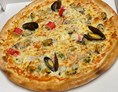 Wirtshaus: Pizza Marinara oder Pizza Frutti di Mare  - Kirchenwirt