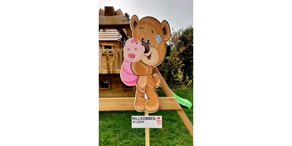 Händler - Gleisdorf - Sehr beliebt als Alternative zum traditionellen Holzstorch ist unser Baby-Bär aus Holz. - Sweet-Prints.at