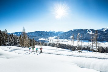 Betrieb: Pistenspaß beim Skifahren oder Rodeln im Winter in Radstadt. - Radstadt Tourismus
