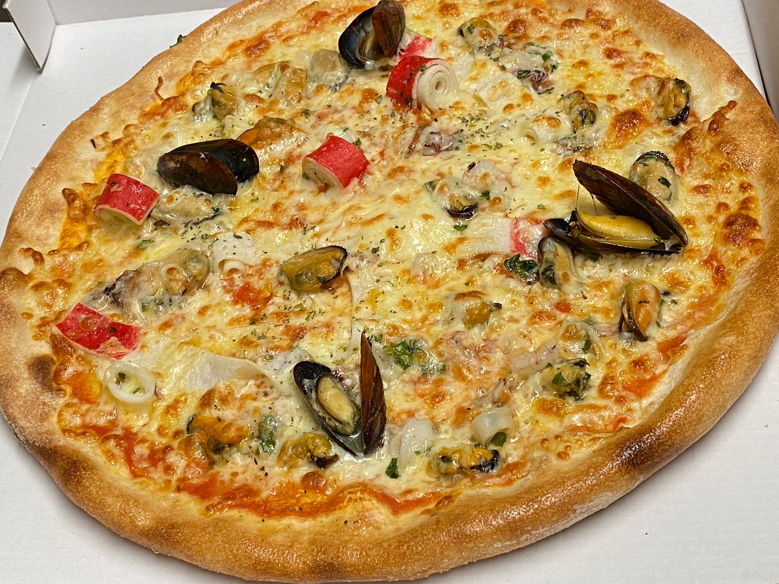 Unternehmen: Pizza Marinara oder Pizza Frutti di Mare  - Kirchenwirt