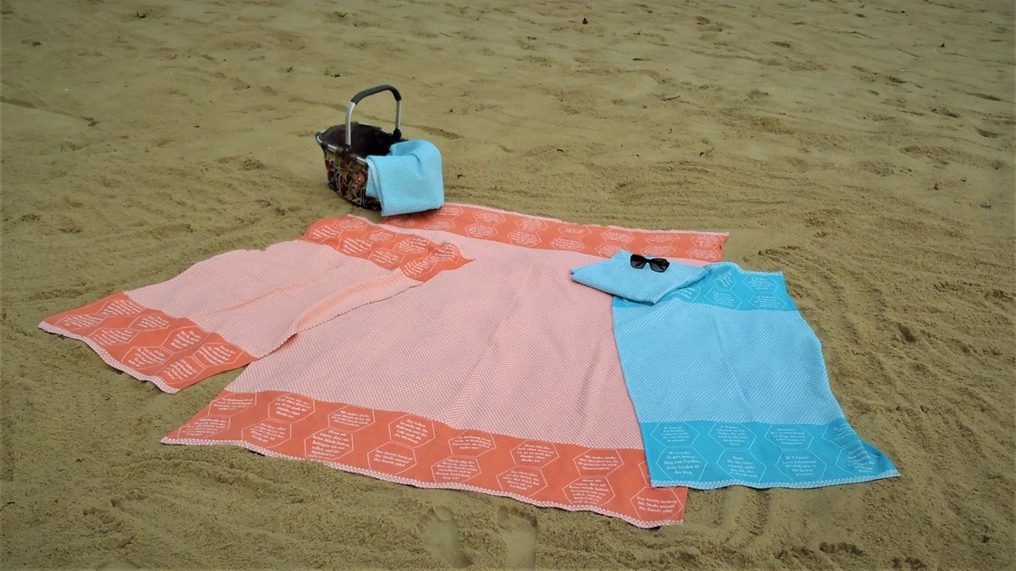 Unternehmen: Strandtücher bzw. Freizeittuch aus BIO-Baumwolle, mit eingewebten Botschaften. - verum textilia by Armin Landskron
