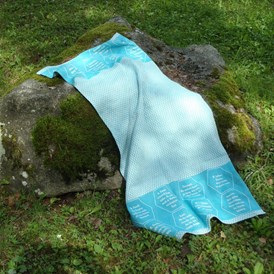 Unternehmen: Strandtücher bzw. Freizeittuch aus BIO-Baumwolle, mit eingewebten Botschaften. - verum textilia by Armin Landskron