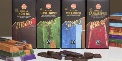 Händler - PLZ 5161 (Österreich) - Hochwertige Schweizer Schokolade, bio und fair, ohne Aluminiumwickel und Sojalezethin - Weltladen Gneis